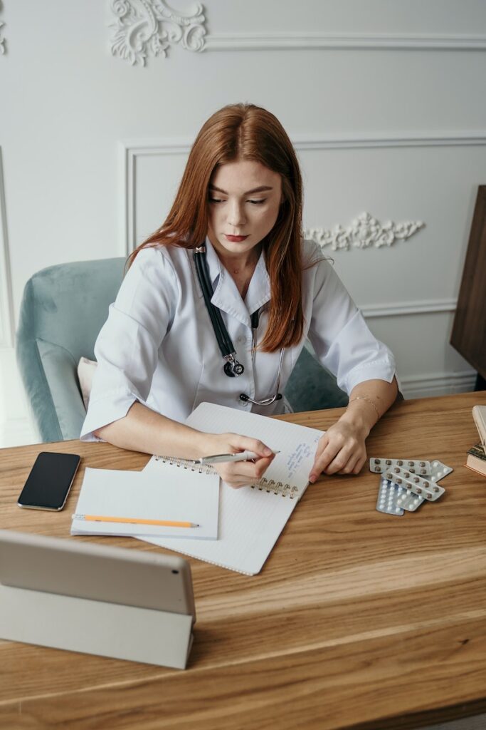 Woman writing on notepad